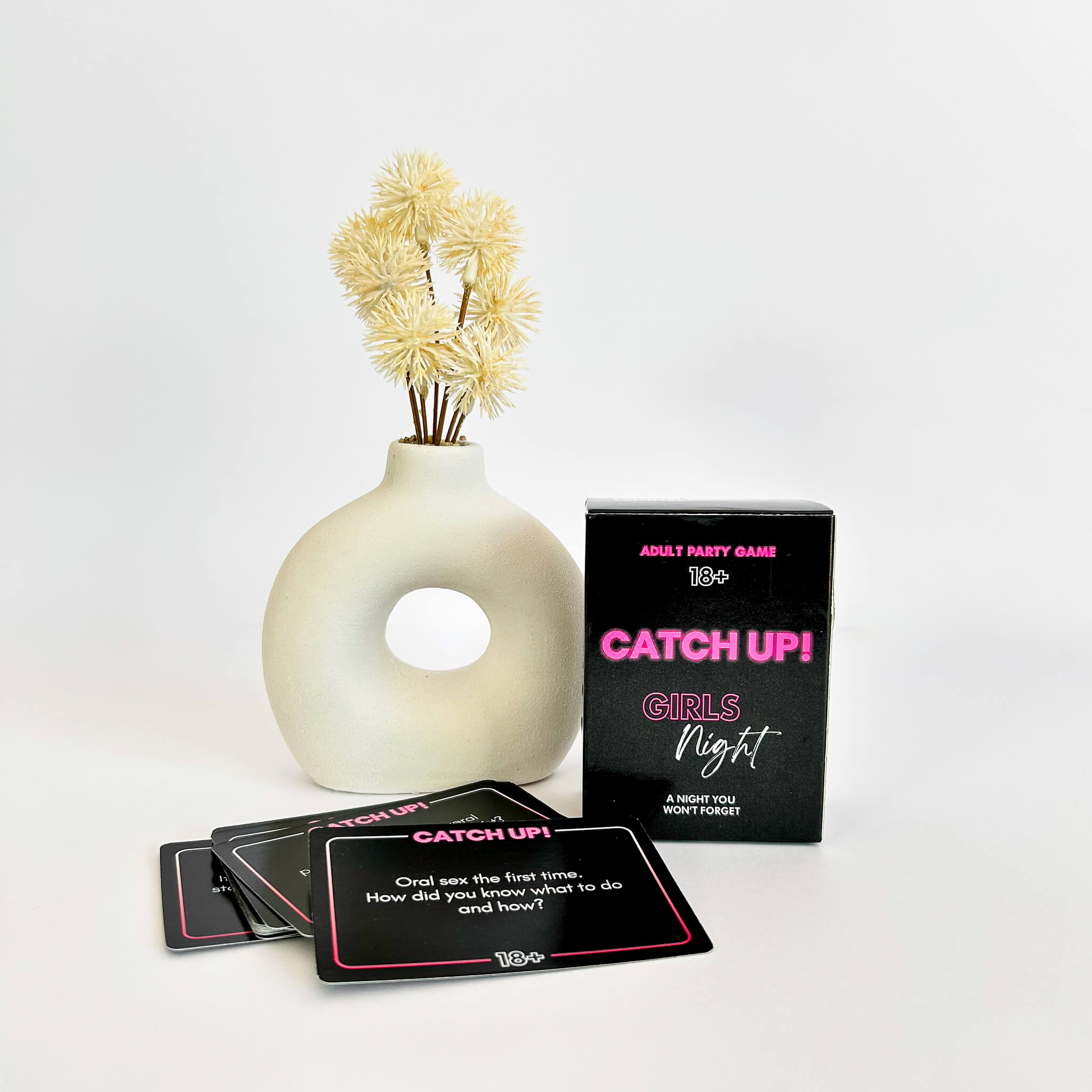 Card game box titled 'Catch Up! Girls Night' with playing cards and a vase on a white background