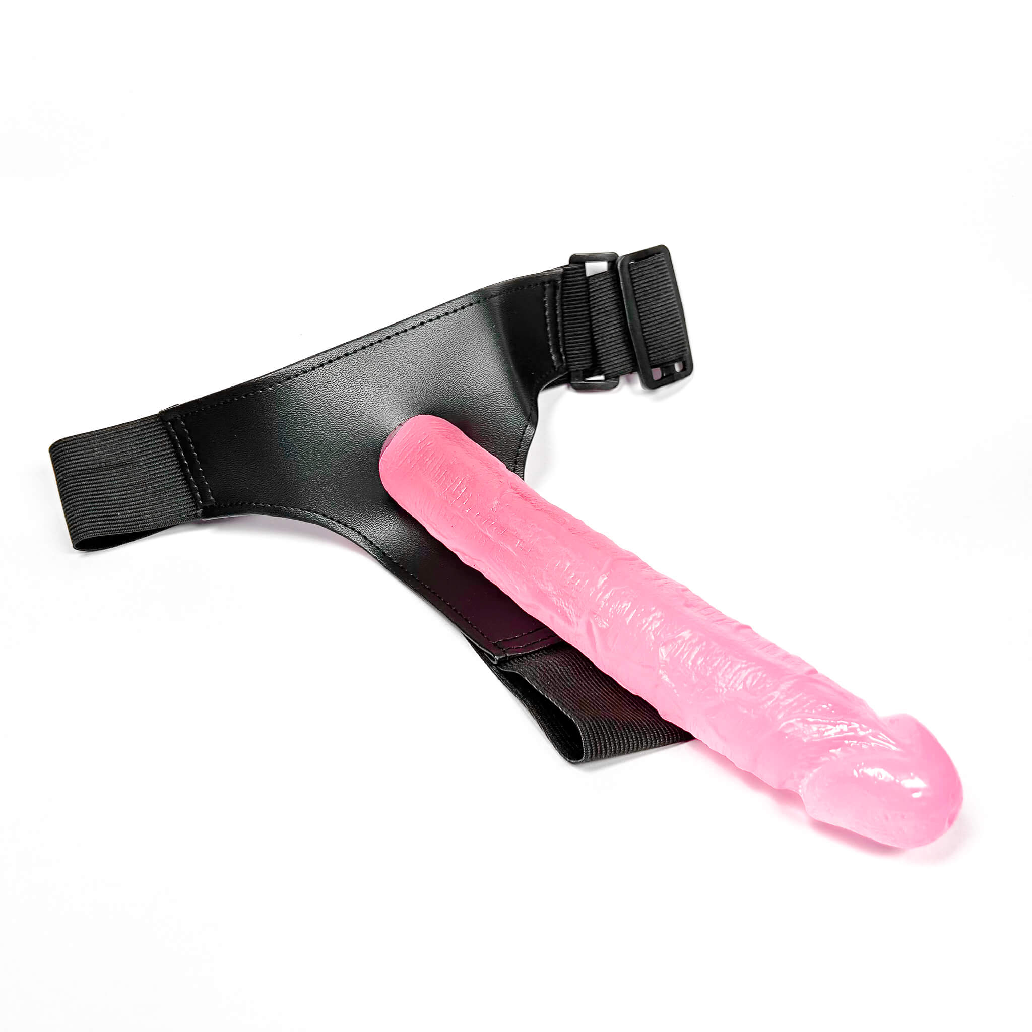strap on harness with a pink soft dildo on a white background
