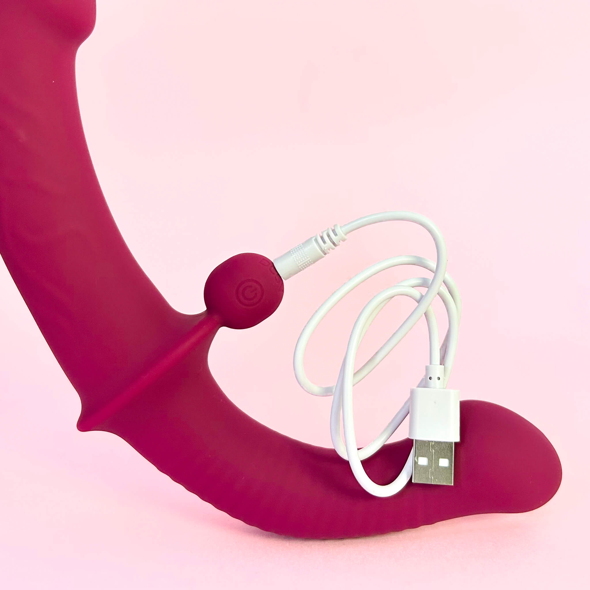 Flexible double ended vibrator south africa with USB cable on a pink background
