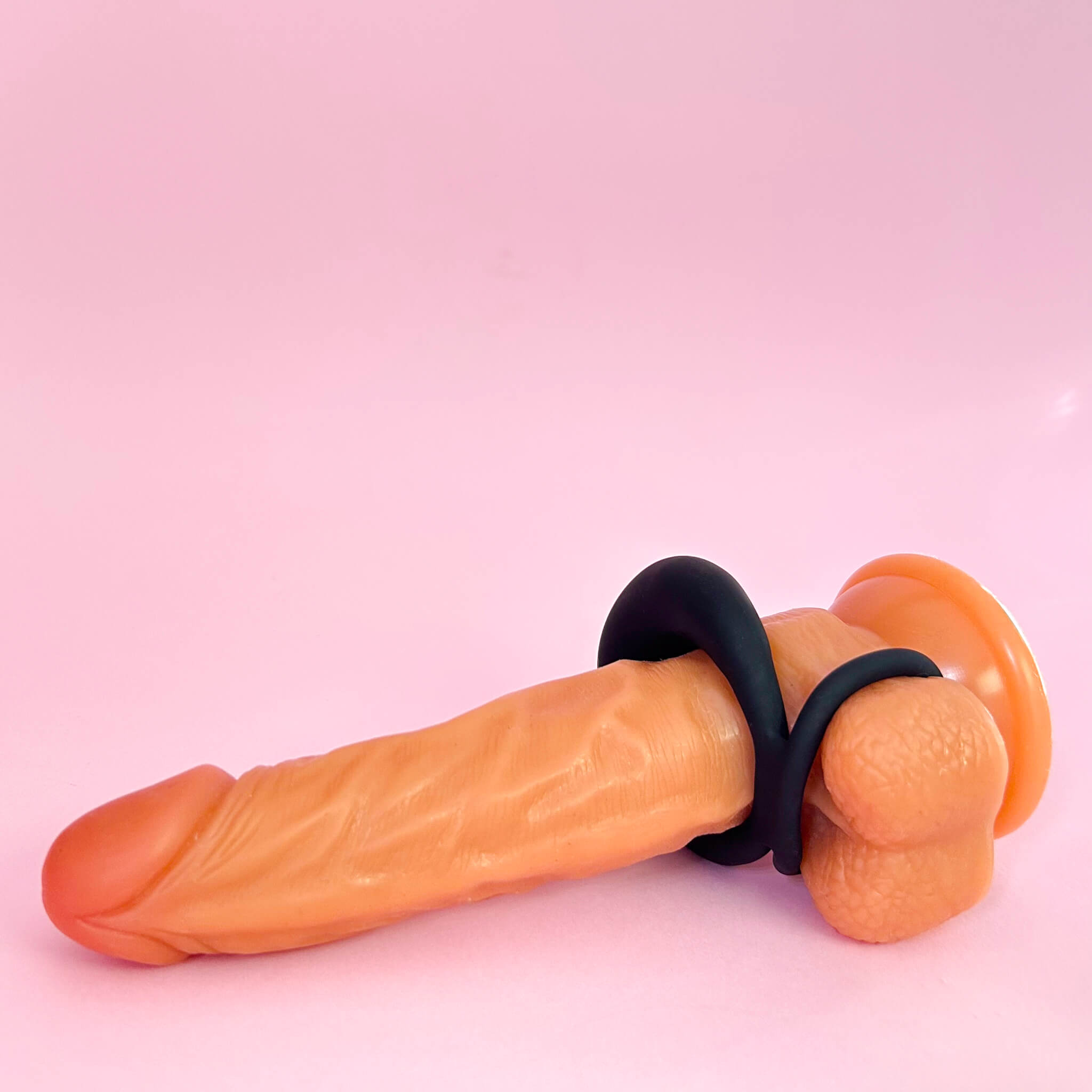 Sexual product with black band on a pink background