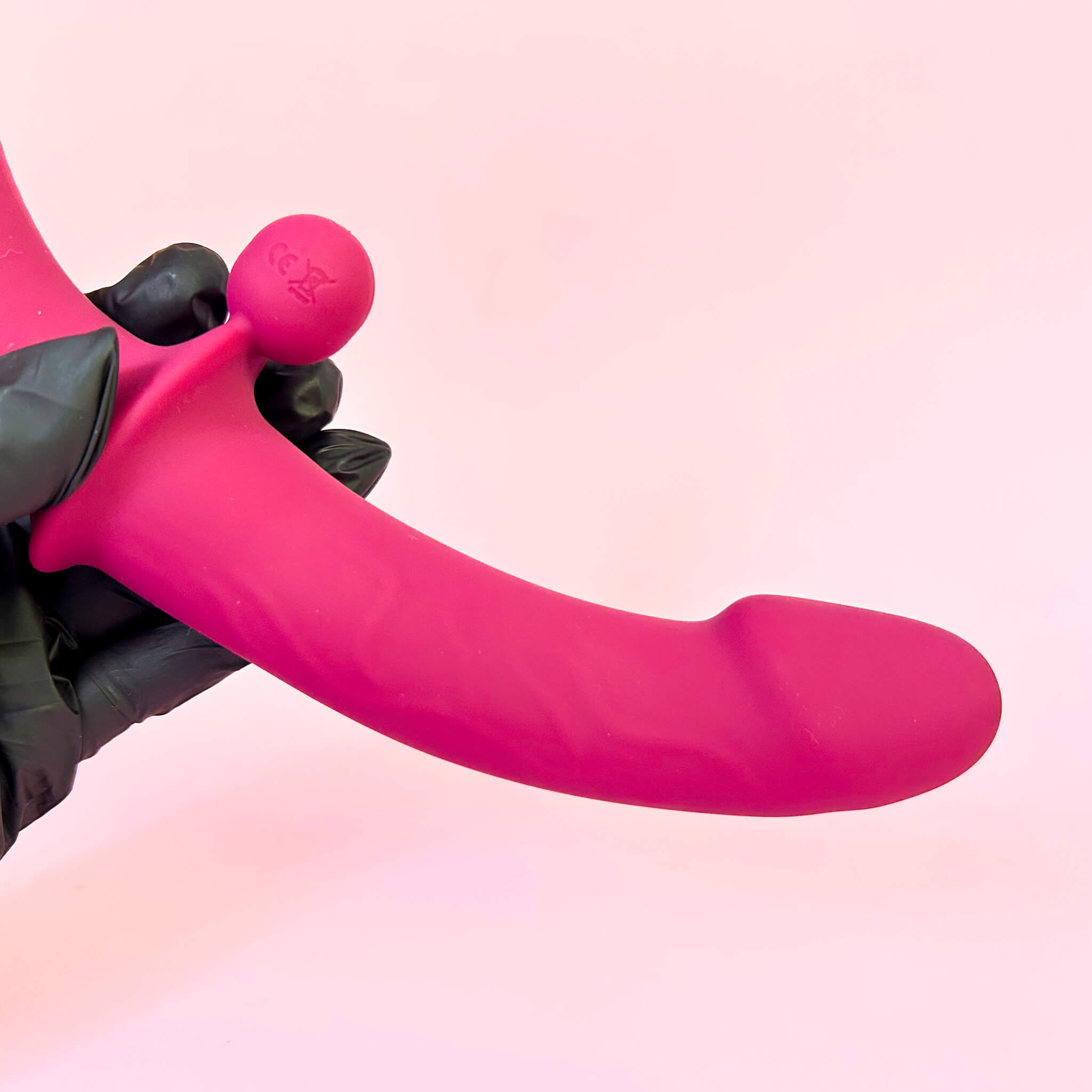 Remote Double Ended Dildo Vibrator on a pink background