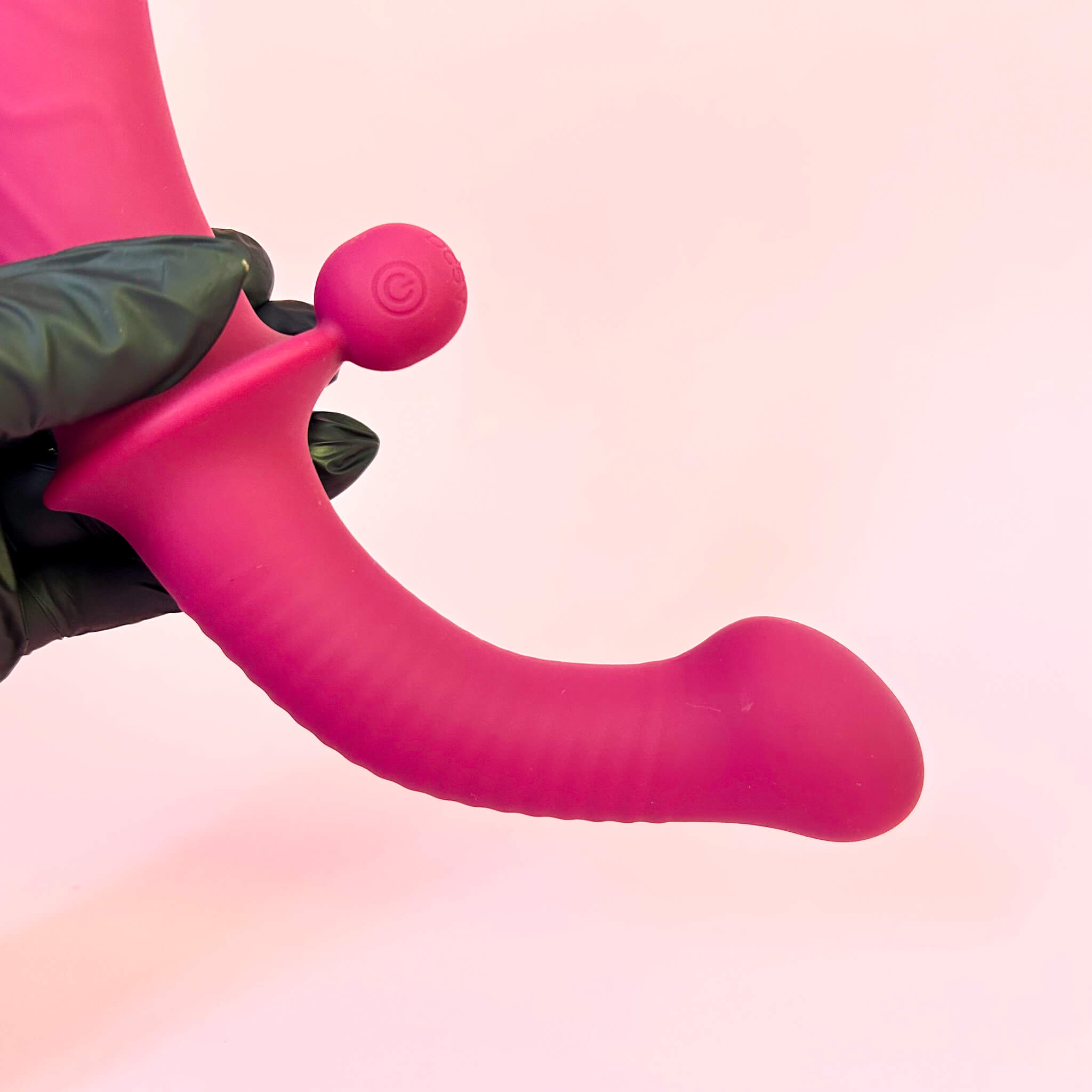 Remote Double Ended Dildo Vibrator South Africa with a spherical end on a pink background