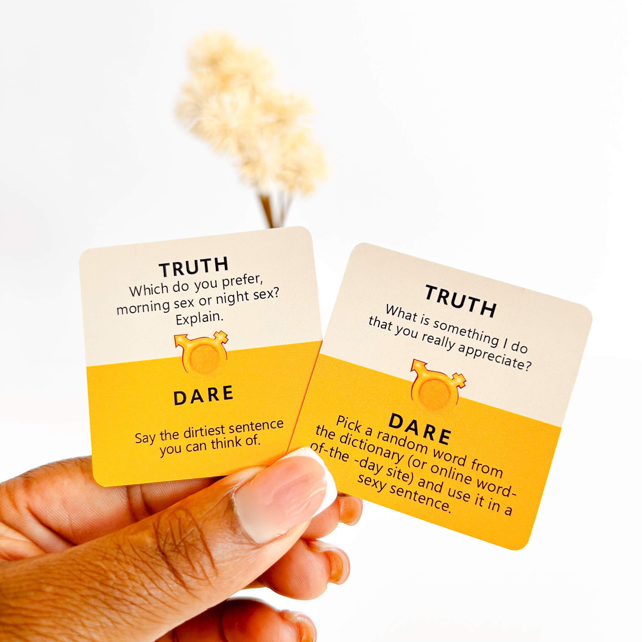 Two cards with 'Truth' and 'Dare' questions on a white background