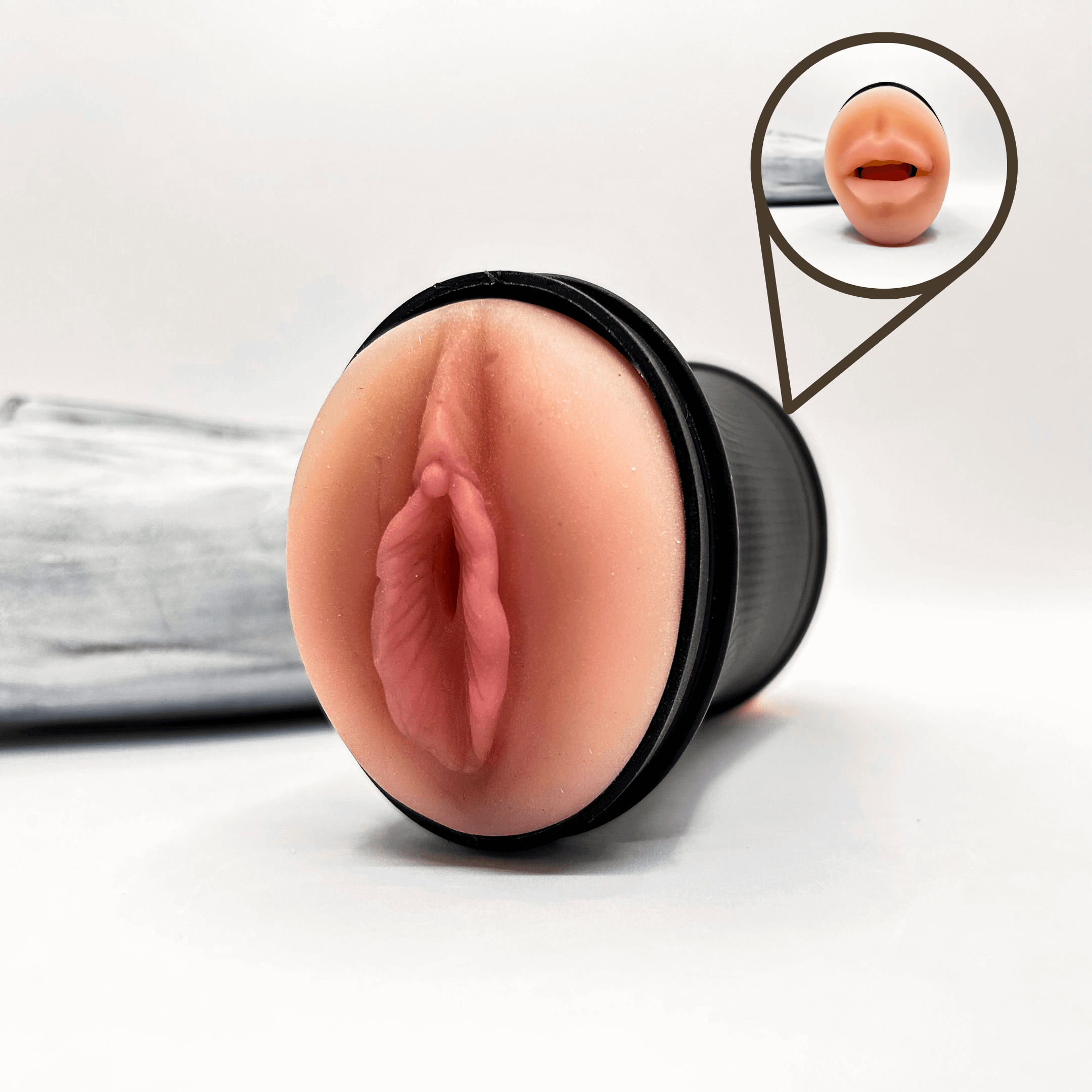 Realistic masturbator on a white background with a close-up inset.