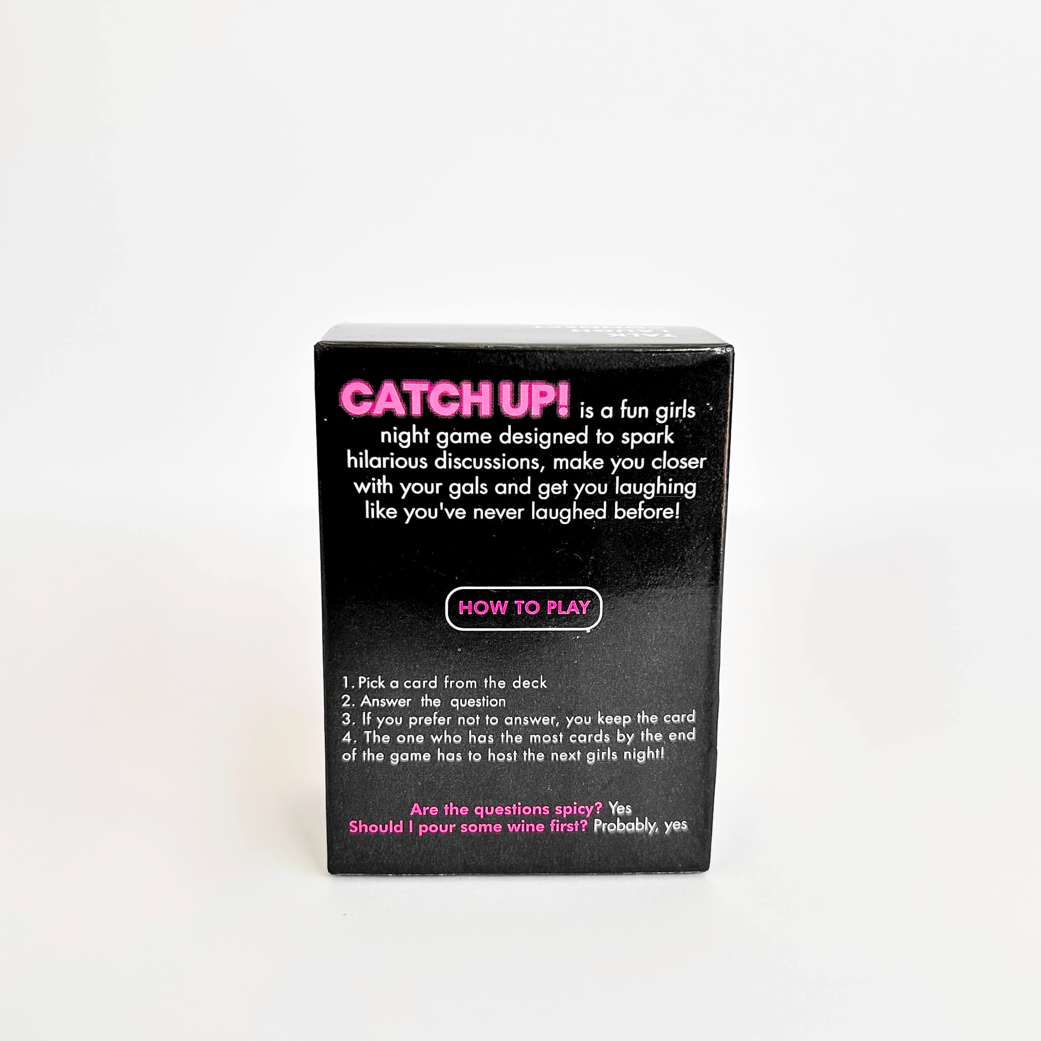 Black catch up card game box with pink and white text on a white background