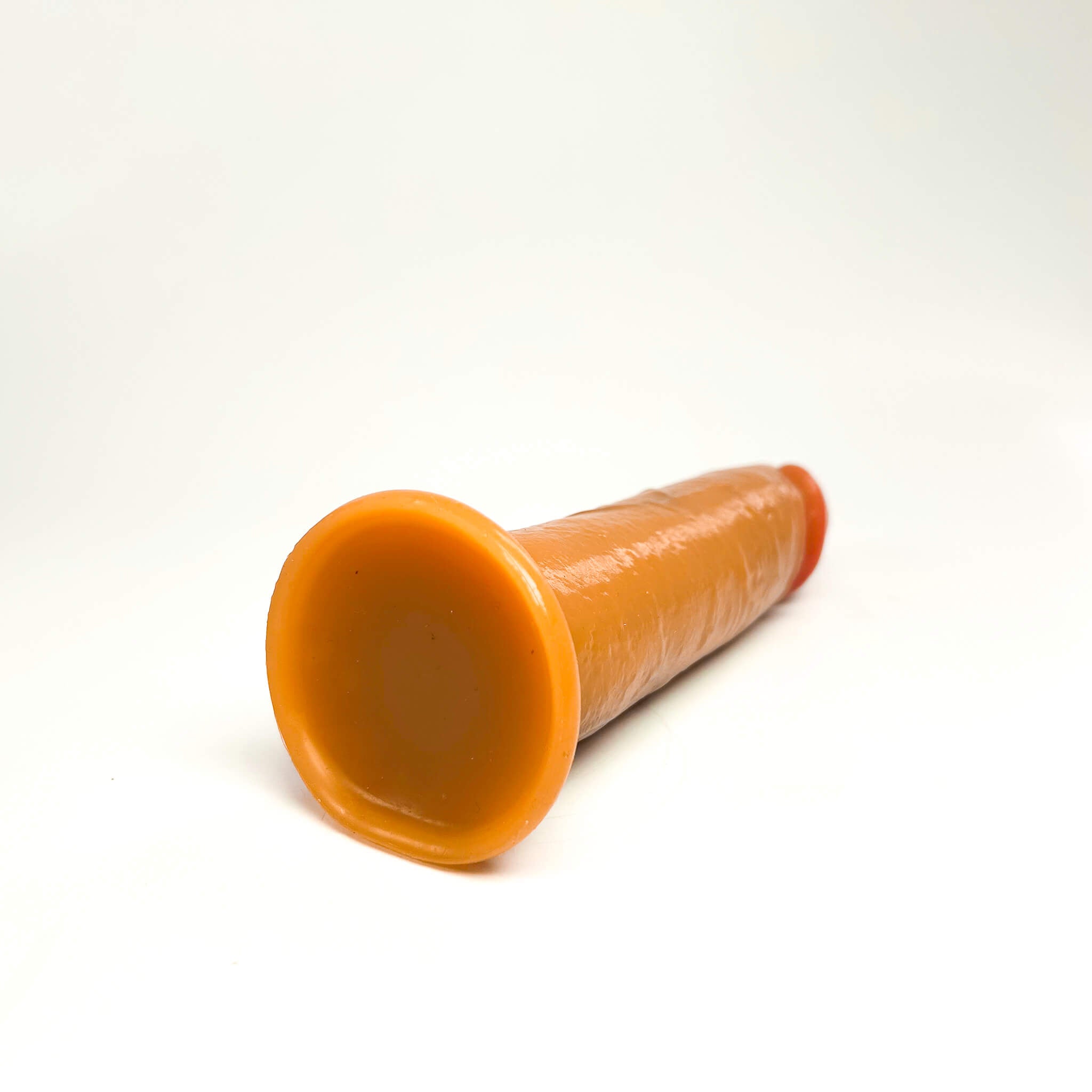 medium realistic dildo on a white background