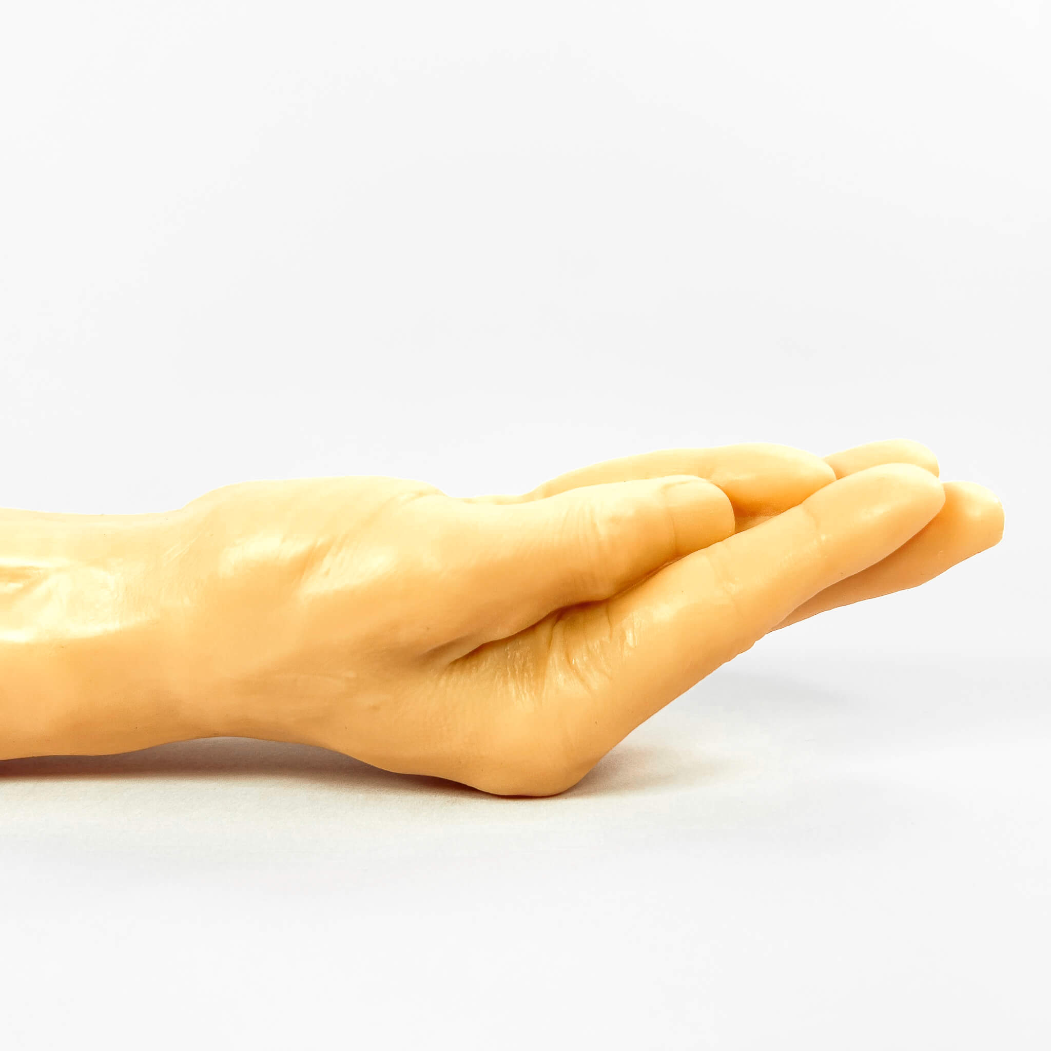 realistic hand dildo on a white background