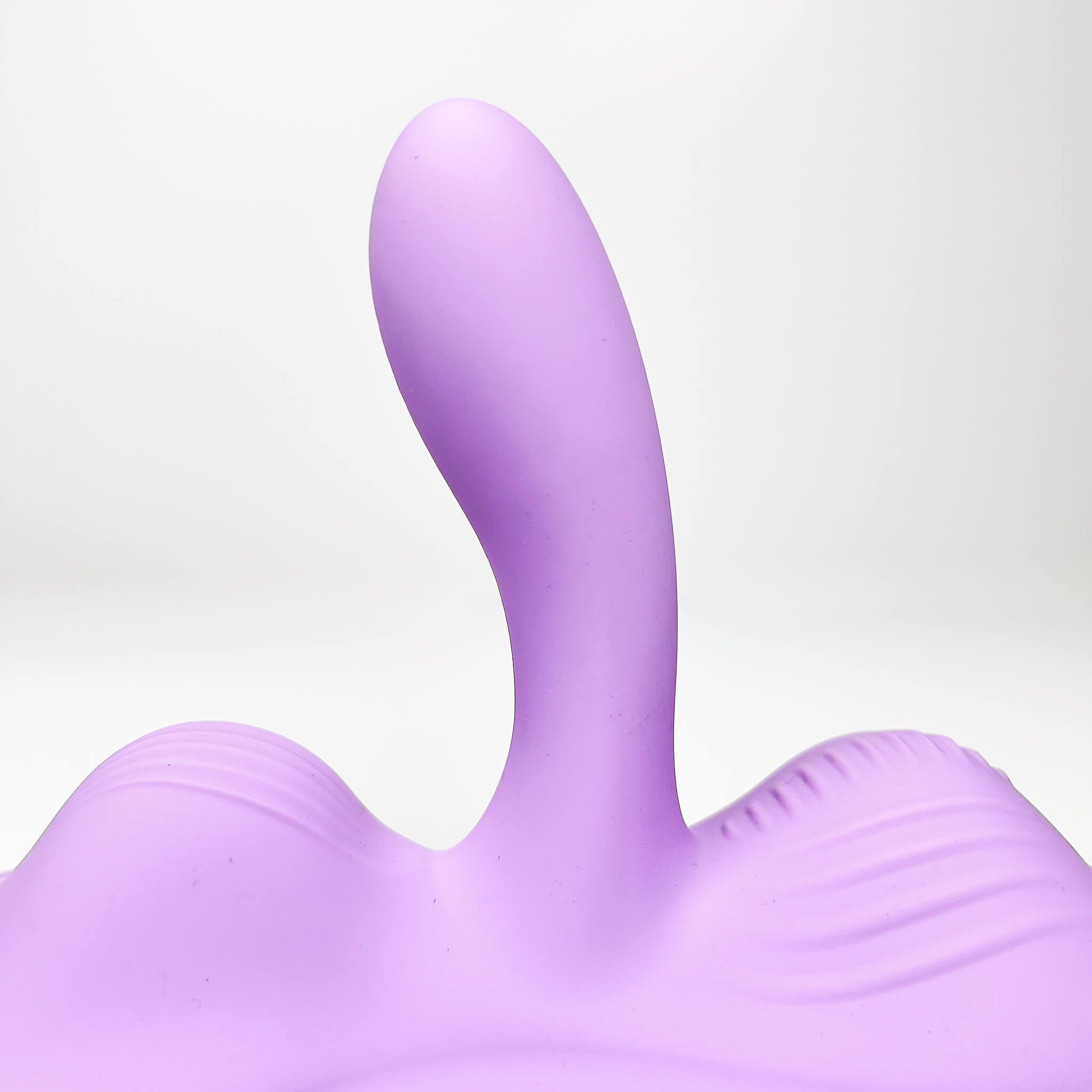 Purple app controlled riding vibrator on a white background