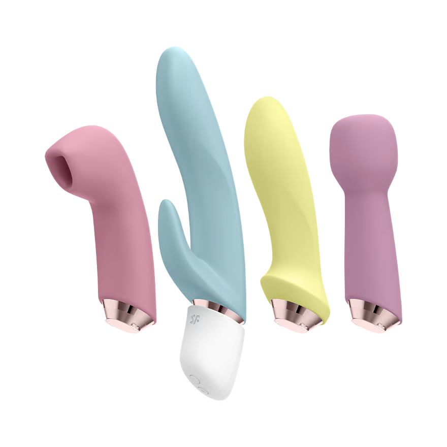 Set of four colorful handheld massagers with rose gold bases on a white background