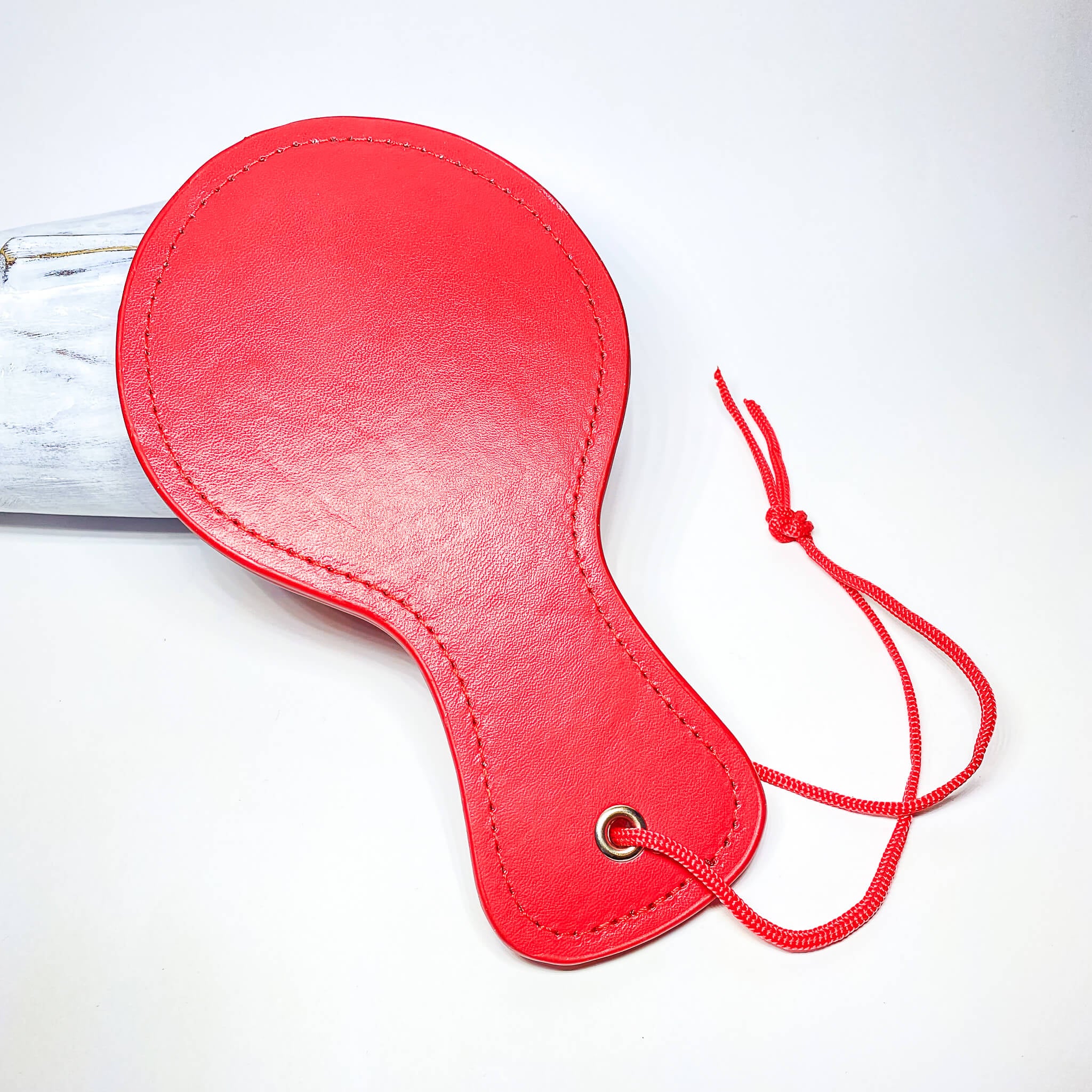 red bdsm paddle
