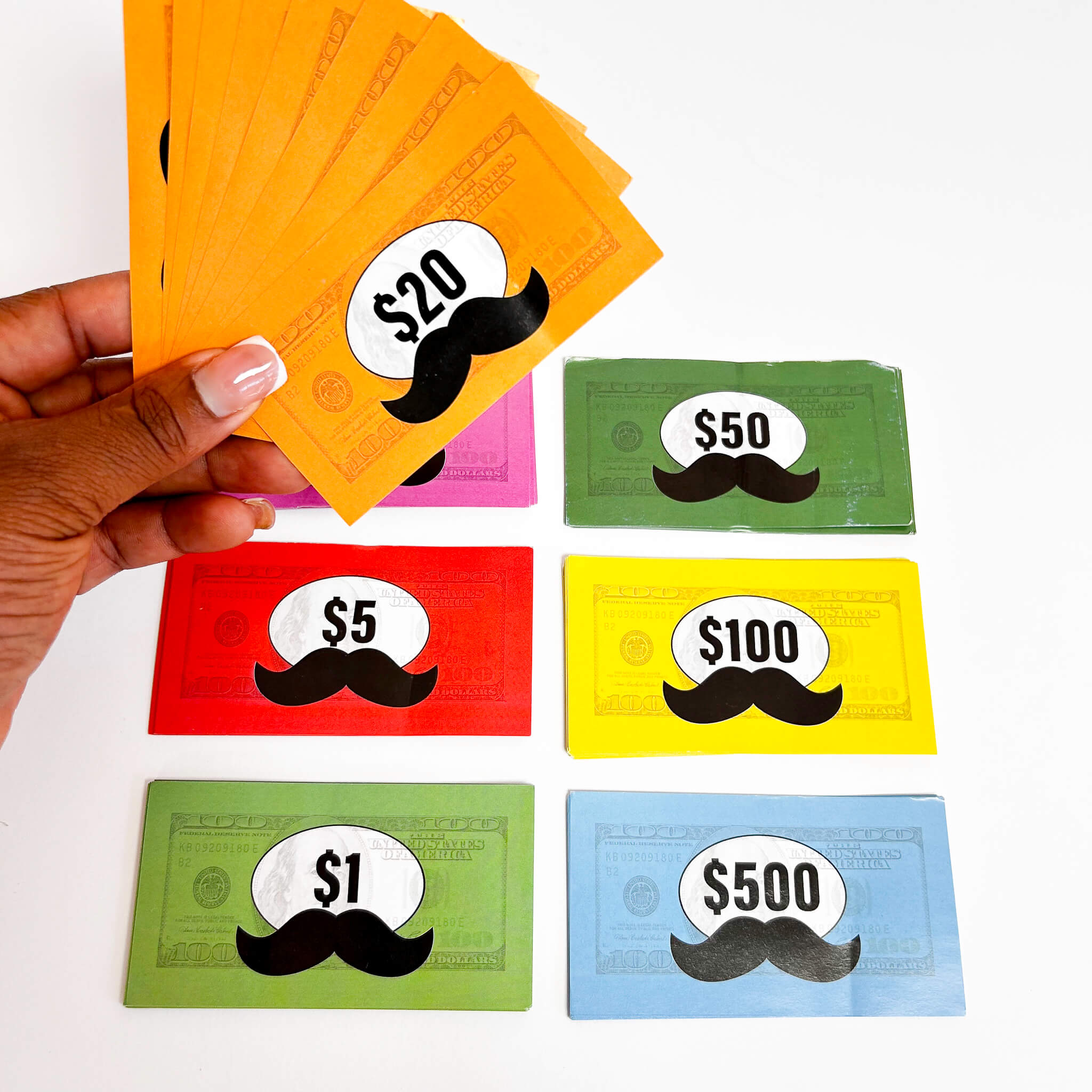 Colorful money-like cards with mustache designs and text values on a white background.