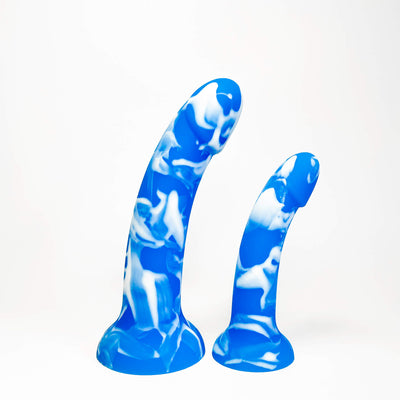 Two curved silicone adult dildodisplayed against a clean white background. 
