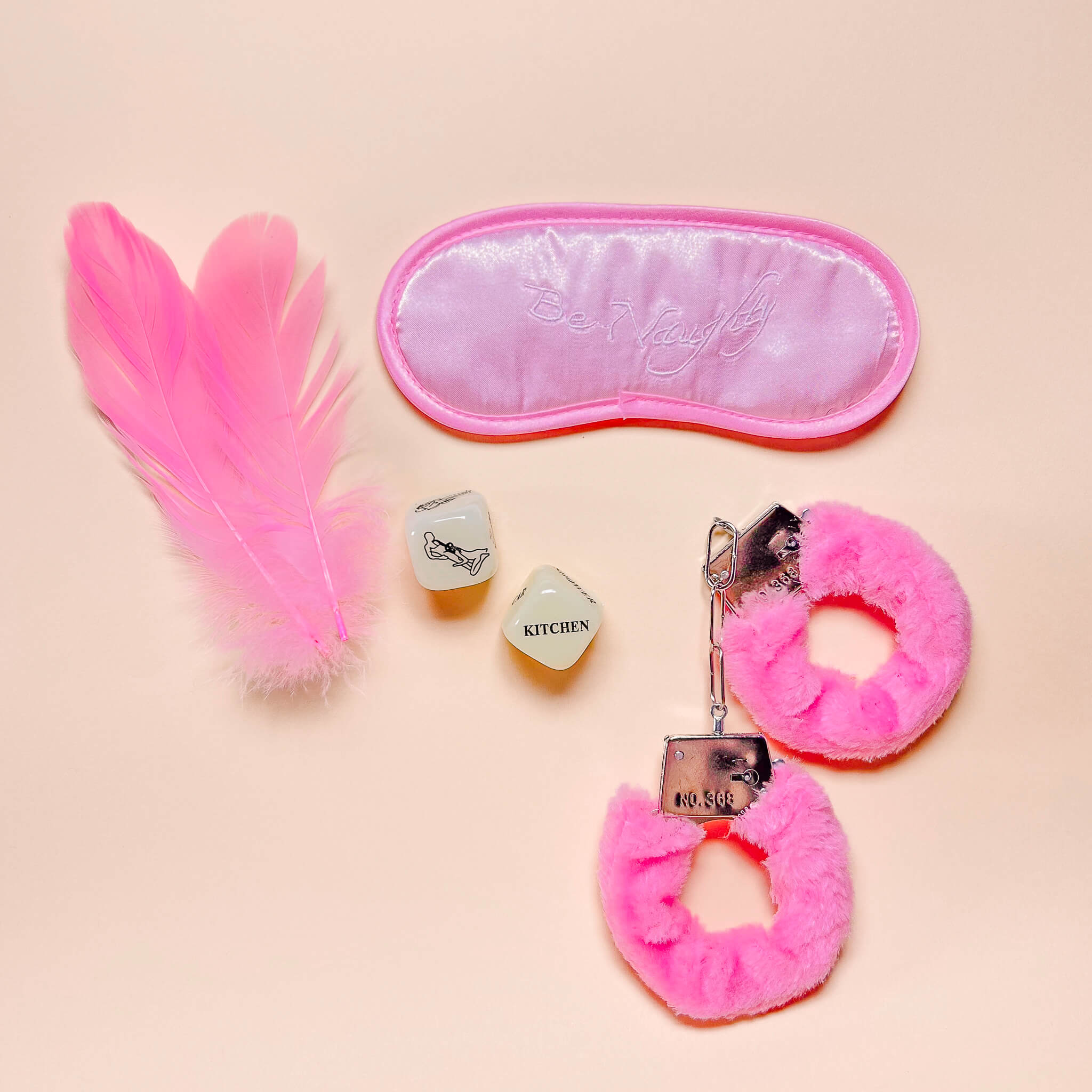Be Naughty Tease-Me Kit on a beige background