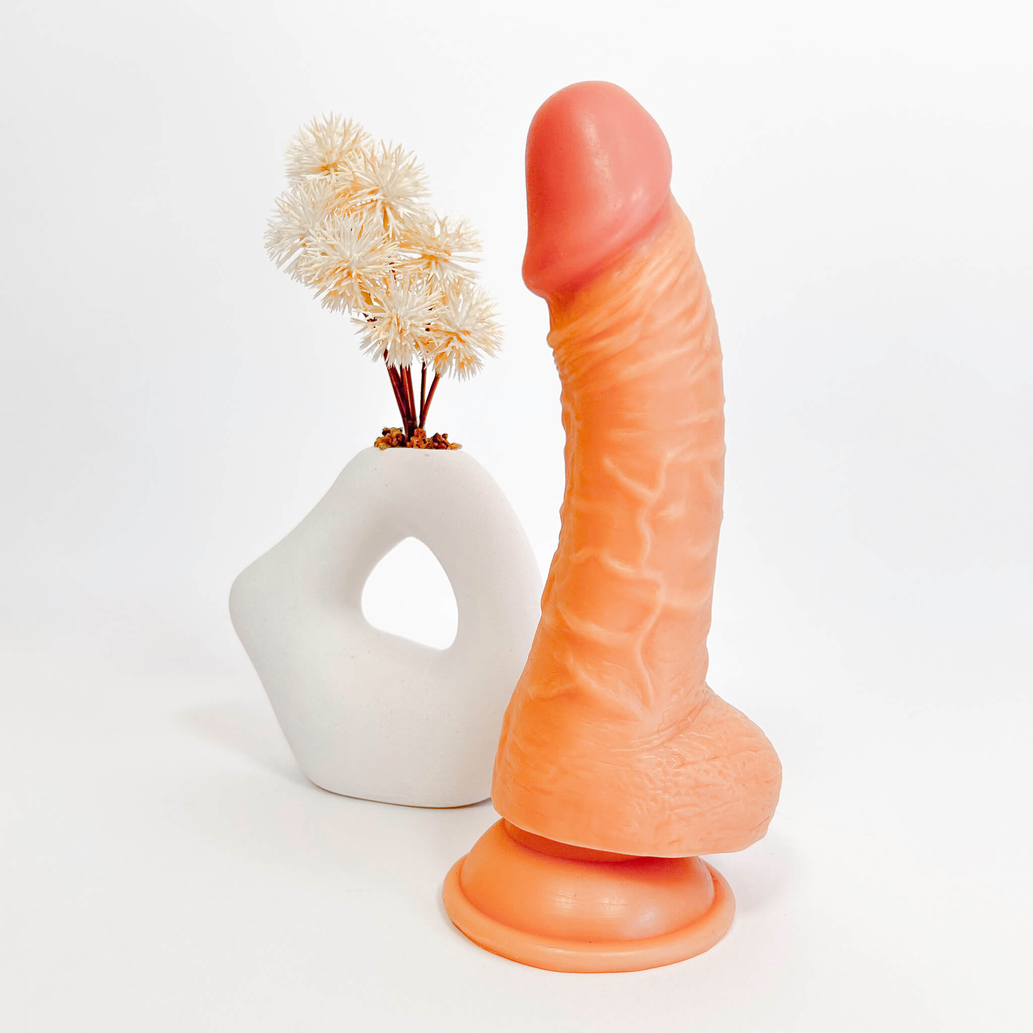 Sexual product resembling a phallic shape on a white background