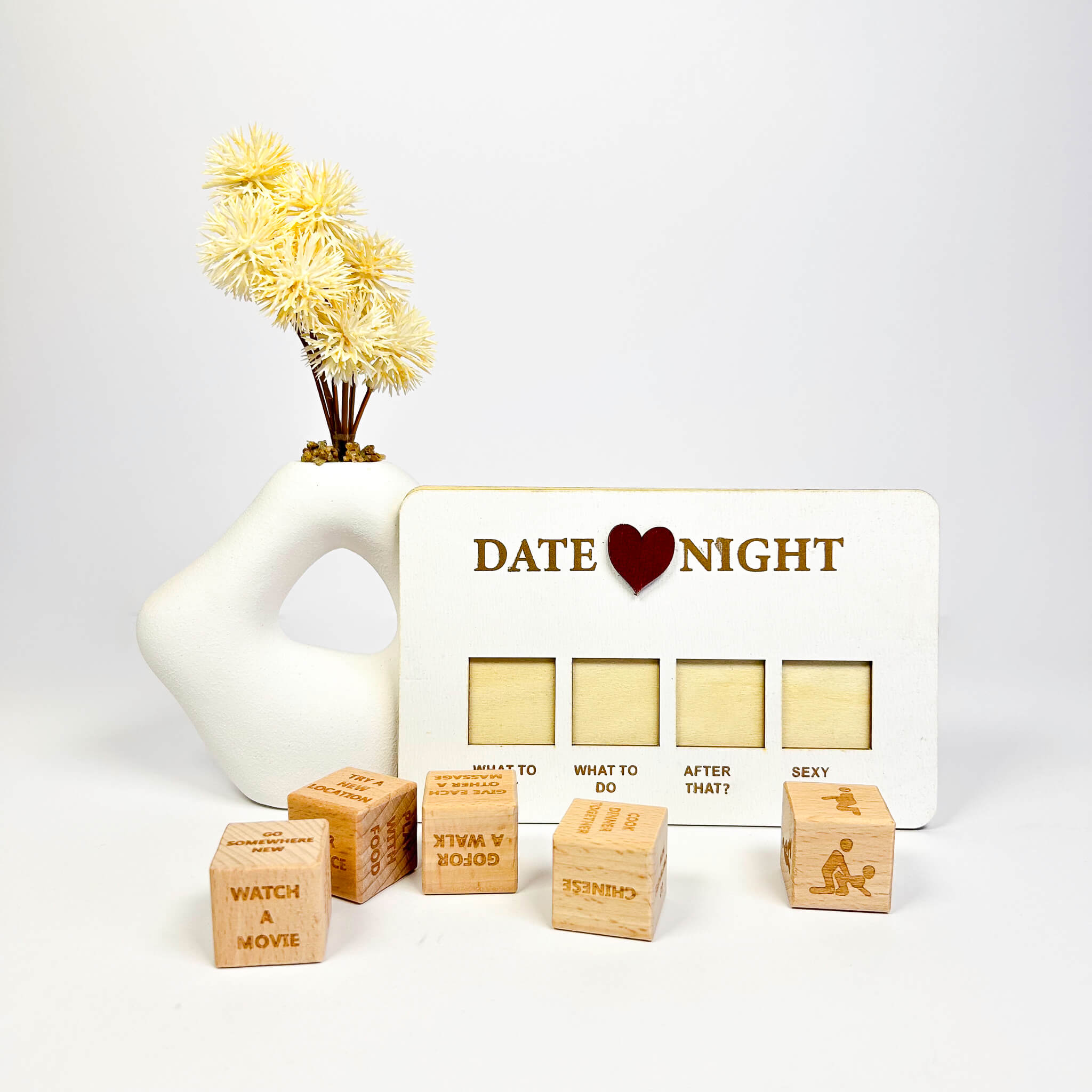 Wooden cubes with text and a 'Date Night' box on a white background