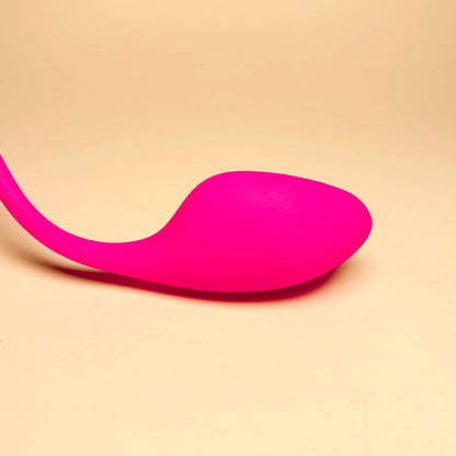 Pink vibrator on a beige background