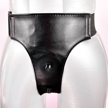 Black leather strapon harness on a mannequin with a white background