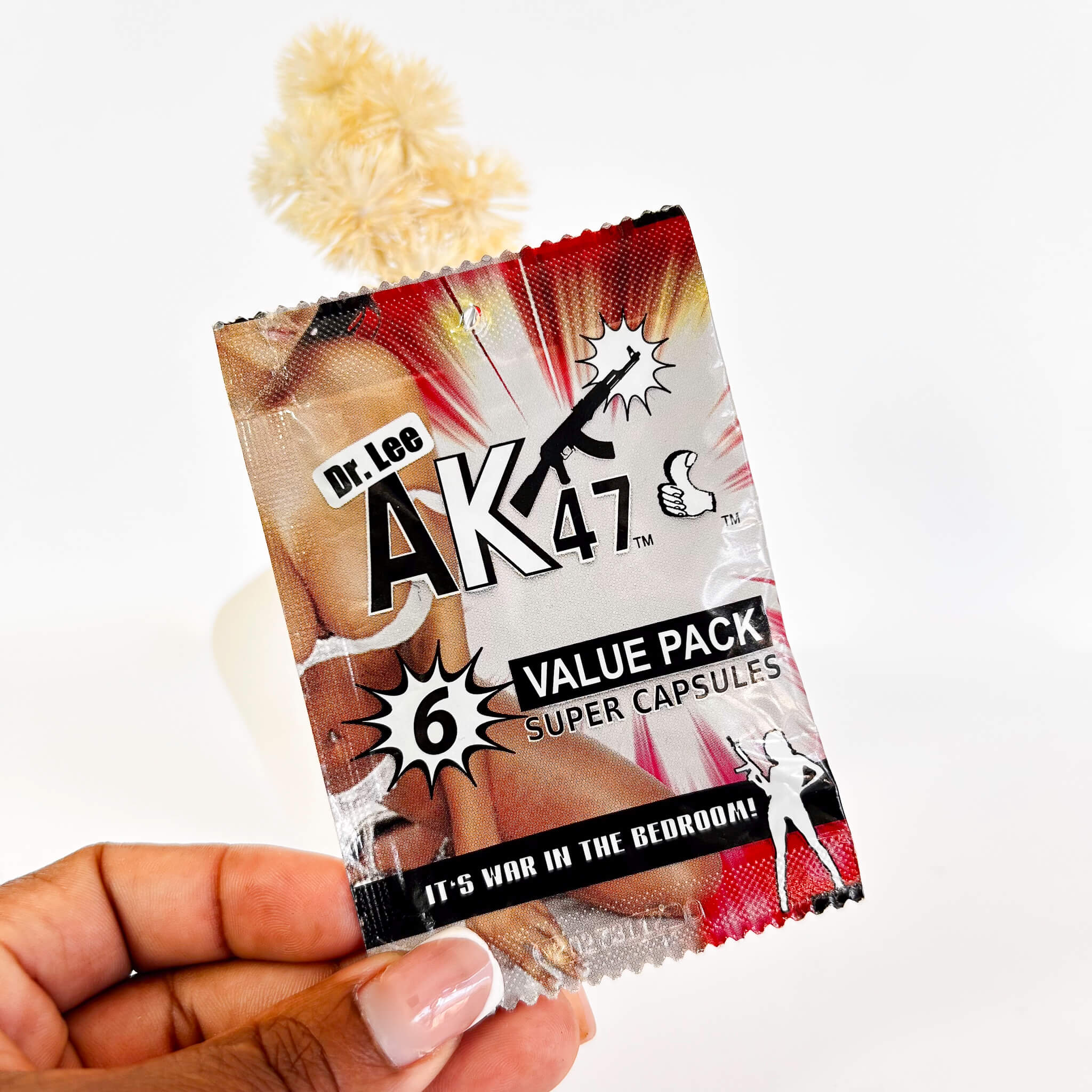 DrLeeAK476SuperCapsules held by a hand on a white background