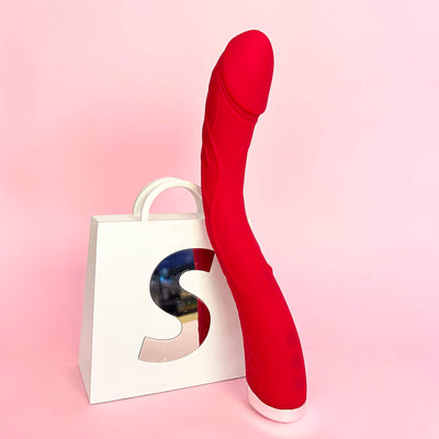 Flexicurve Realistic G-Spot Vibrator with a white box featuring a colorful 'S' on a pink background
