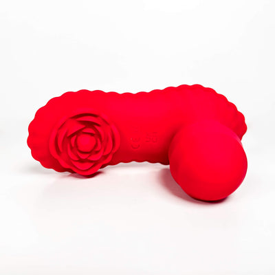 Red adult toy with a rose design on a white background