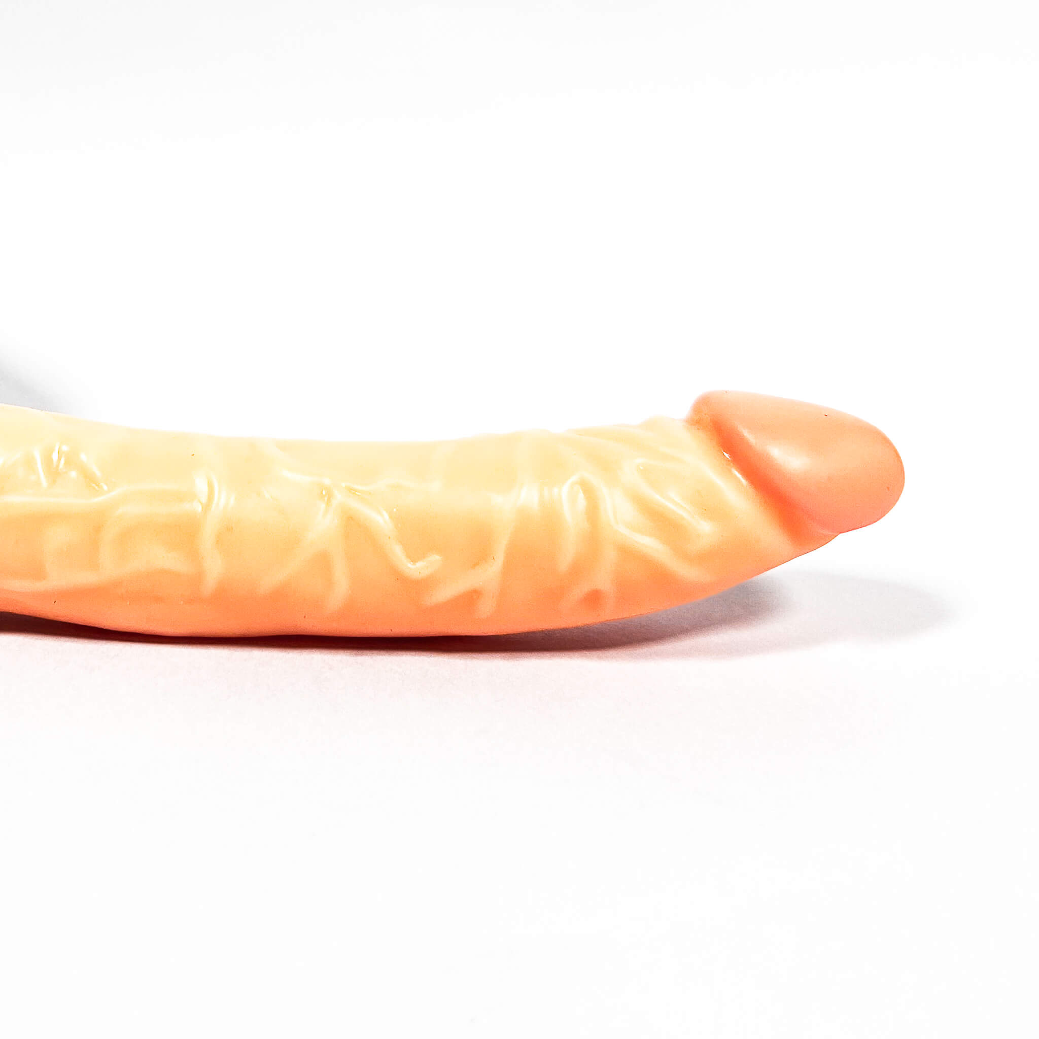 Realistic long dildo on a white background