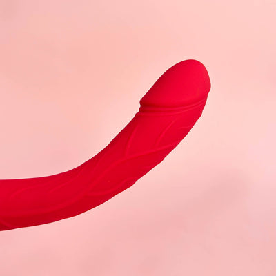 Realistic G-Spot Dildo Vibrator on a pink background