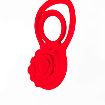 vibrating rose cock ring with a rose design on a white background