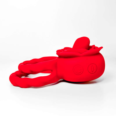 Red silicone rose tongue cock ring on a white background