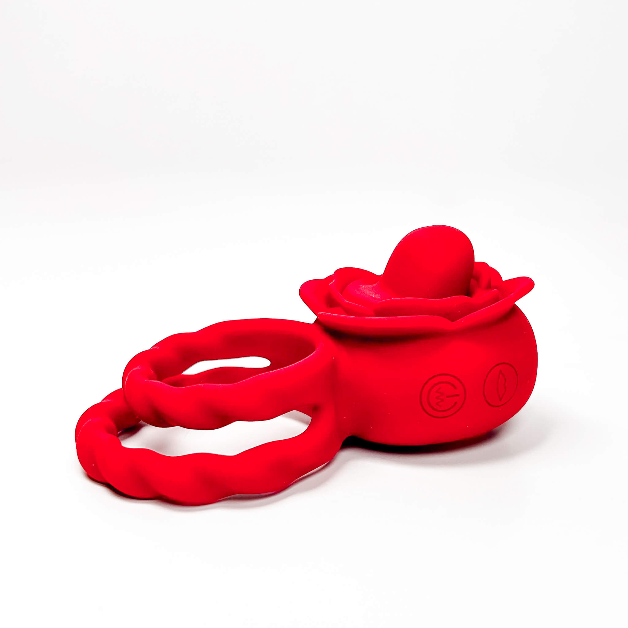 Red silicone cock ring with a rose design on a white background