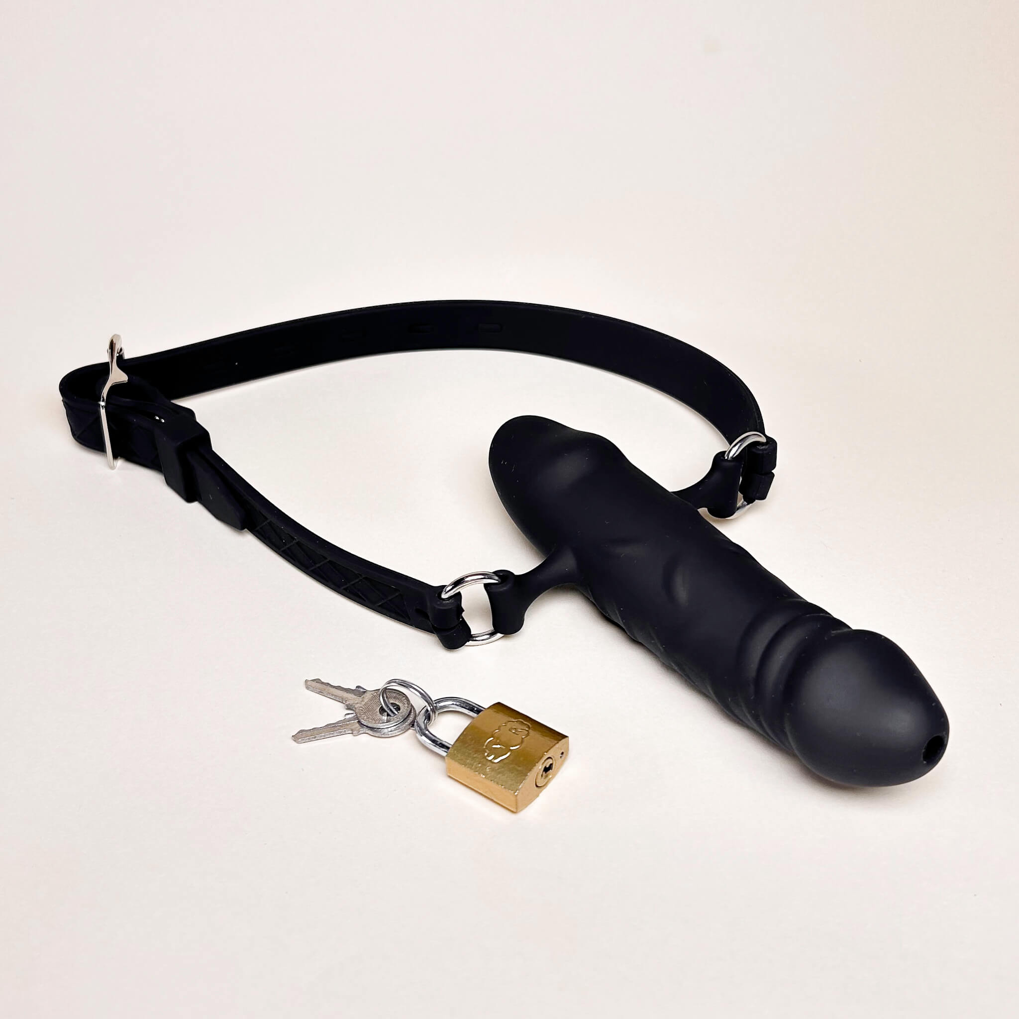 Black Silicone Double Dildo Gag and gold padlock on a white background