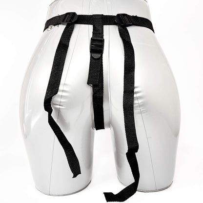 White dummy with black belts on a white background