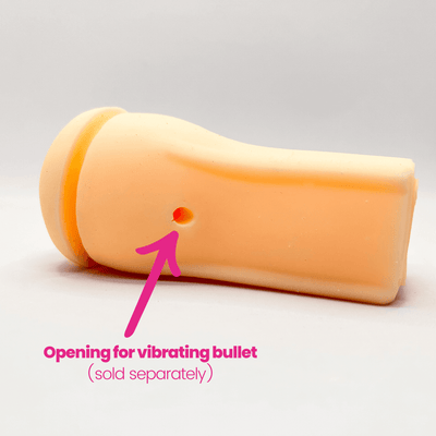 Male masturbator with an opening for a vibrating bullet, on a light gray background