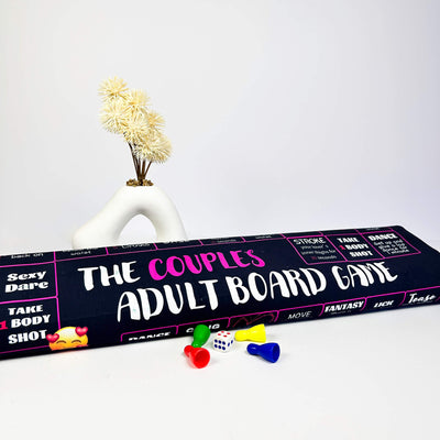Couples adult board game box with game pieces on a white background