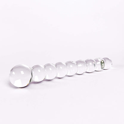 Beaded glass dildo on a white background