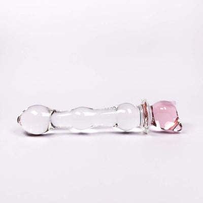 Glass anal dildo with pink and clear components on a white background