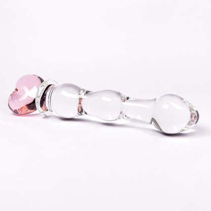 Glass dildo with pink and clear components on a white background