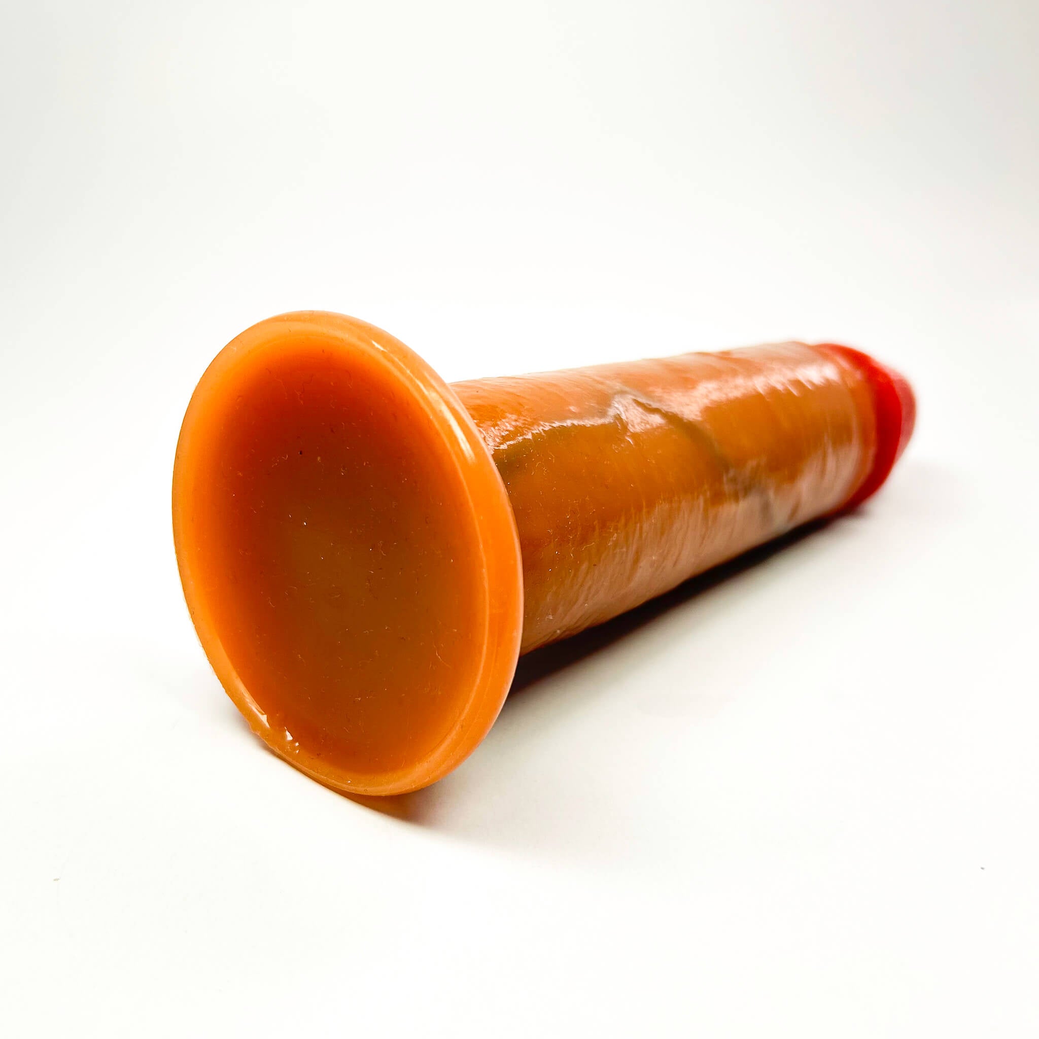 massive realistic dildo on a white background
