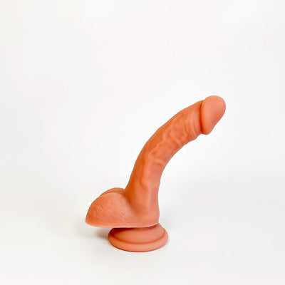 An adult novelty product resembling a realistic penis with a suction cup base, shown against a plain white background.