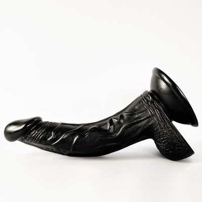black curved dildo on a white background