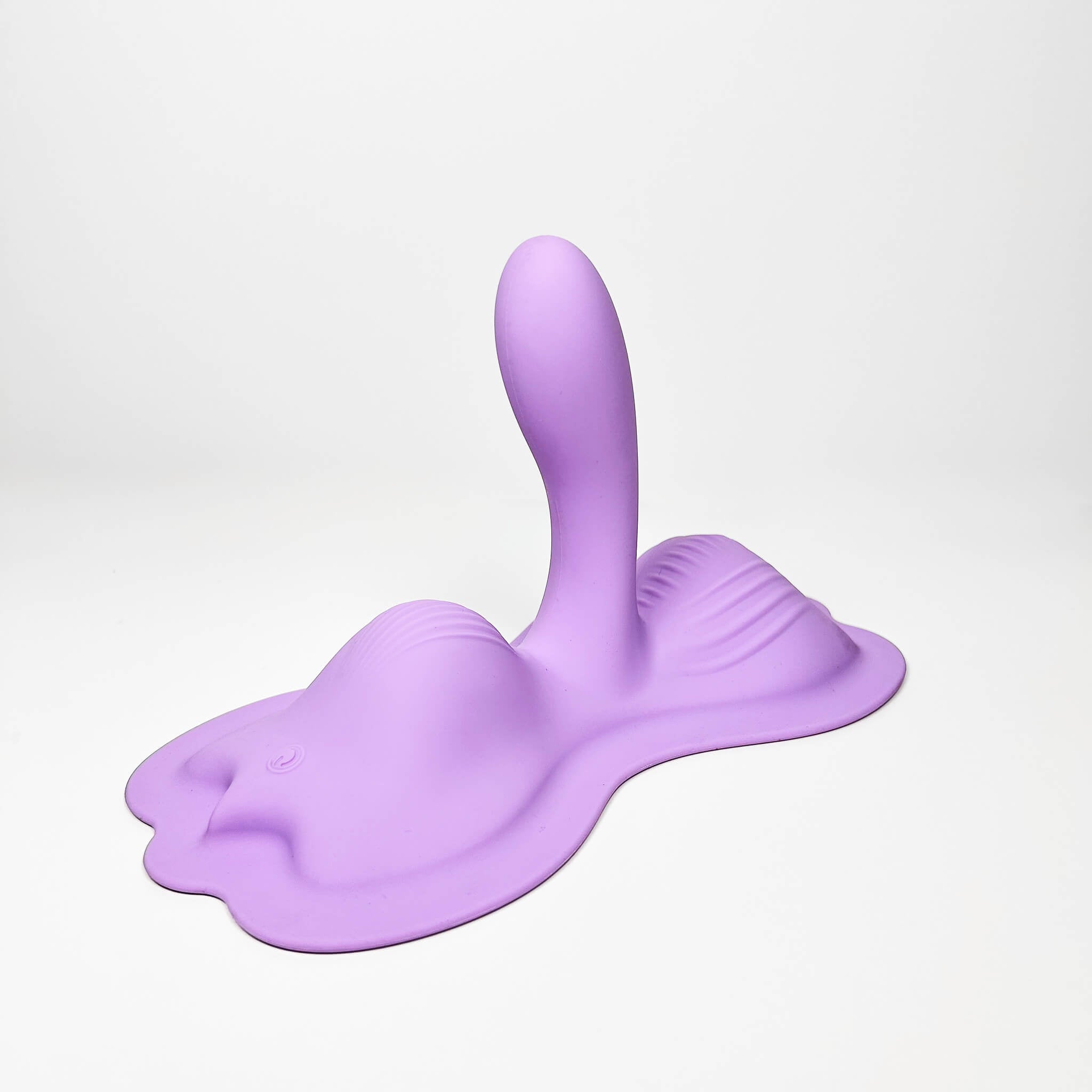 Purple silicone cushion vibrator on a white background