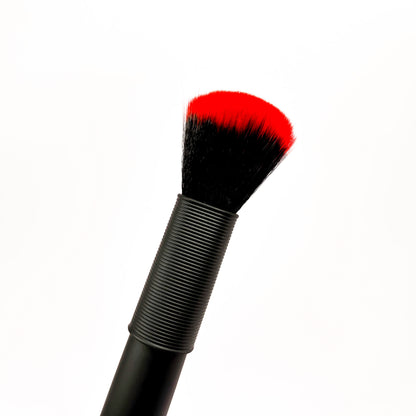 discreet brush vibrator with black handle and red bristle tip on a white background