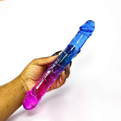 Hand holding a double-sided dildo online object against a white background