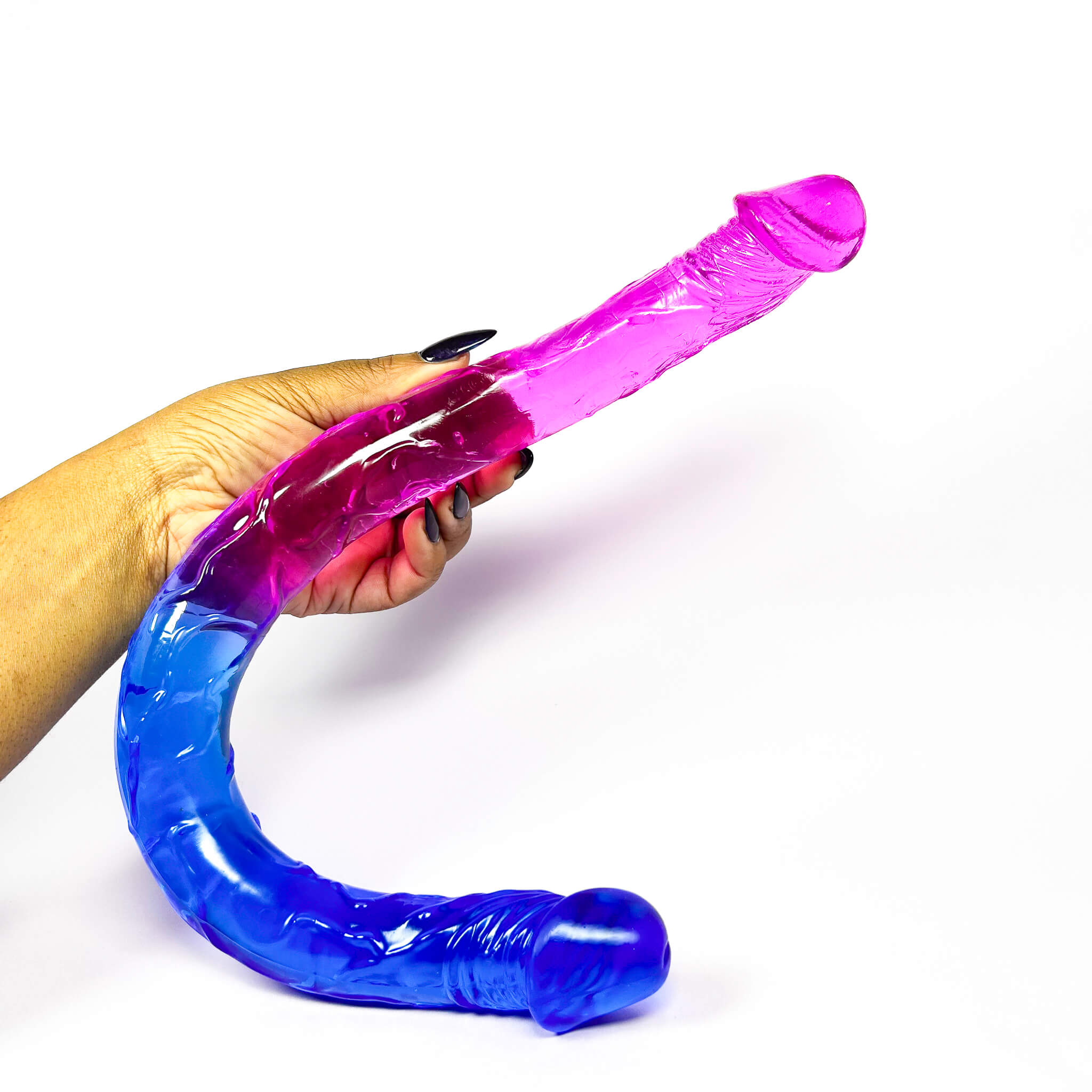 Hand holding a dual-colored blue double sided dildo on a white background