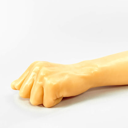 Realistic fisting dildo on a white background