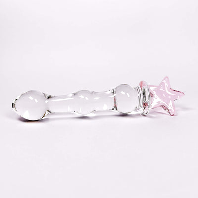 Glass dildo with a pink star on a white background