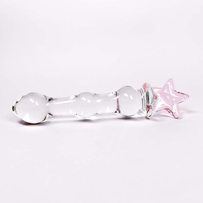 Glass dildo with a pink star on a white background