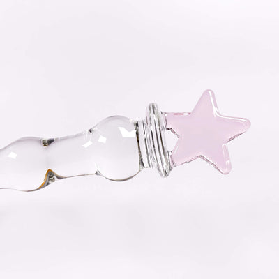 glass sex toy with a pink star on a white background