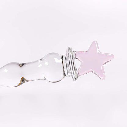 glass sex toy with a pink star on a white background