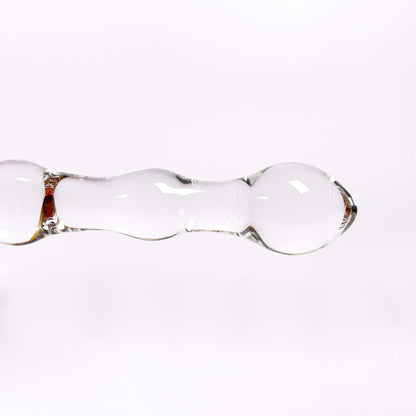 Clear glass dildo on a white background