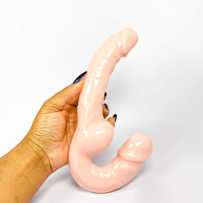 light brown strapless double ended dildo on a white background